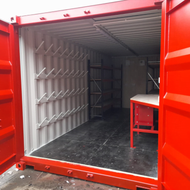 Interior of red 20 ft storage container.