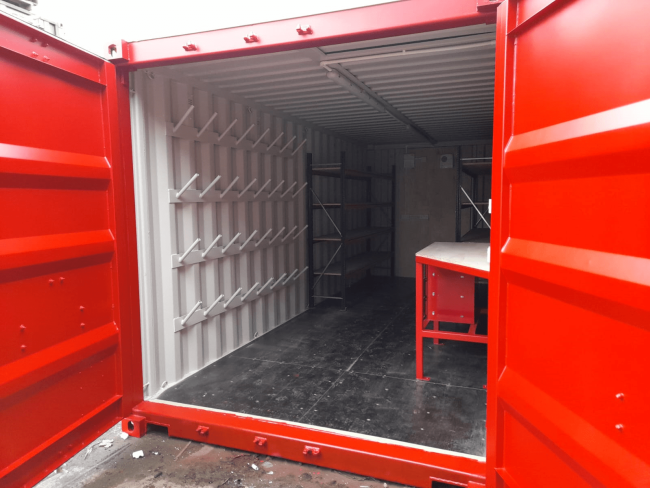 Interior of red 20 ft storage container.