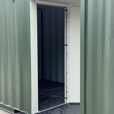 Shipping container toppers door